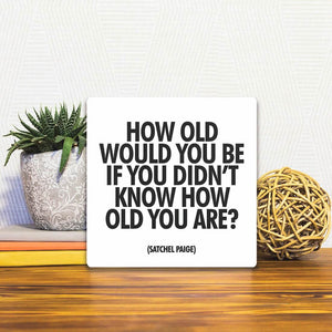 A Slidetile of the How Old Would You Be sitting on a table.