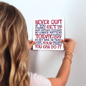 Never quit… Slidetile on wall in office.