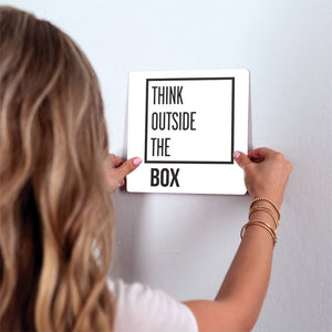 Think outside the box Slidetile on wall in office.