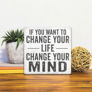 A Slidetile of the Change Your Mind sitting on a table.