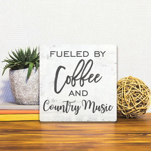 A Slidetile of the Coffee and Country Music sitting on a table.