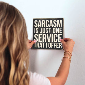 I Offer Sarcasm Slidetile on wall in office.