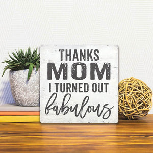 A Slidetile of the Thanks Mom sitting on a table.