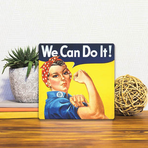 A Slidetile of the We Can Do It sitting on a table.