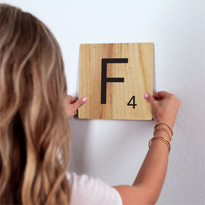 Letter F - Light Wood Slidetile on wall in office.