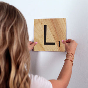 Letter L - Light Wood Slidetile on wall in office.