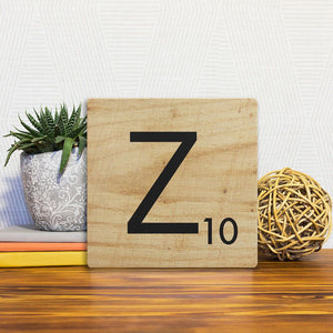 A Slidetile of the Letter Z - Light Wood sitting on a table.